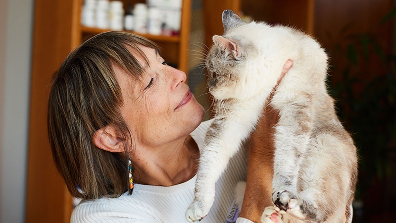 Dr. Laurel looks lovingly at her cat Bee