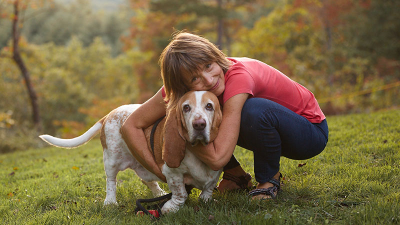 dr. Laurel hugs senior basset hound